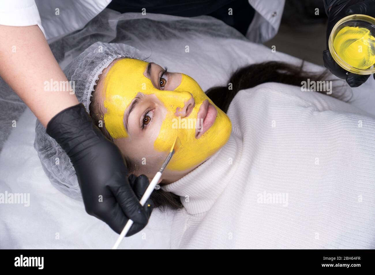 Beauty salon, facial peeling mask with retinol treatment and fruit