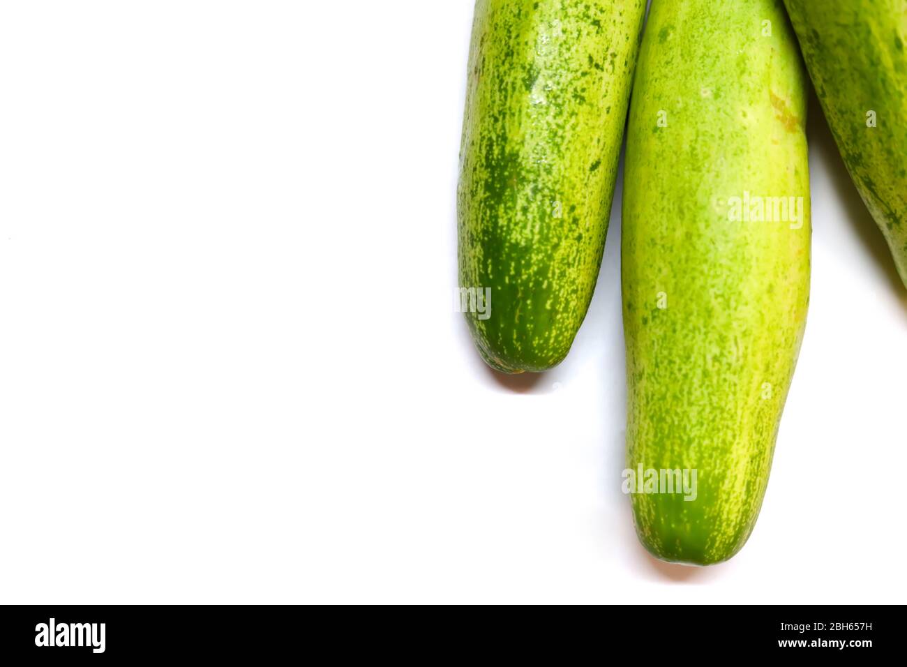 Three cucumbers on an isolated white backgrounds Stock Photo