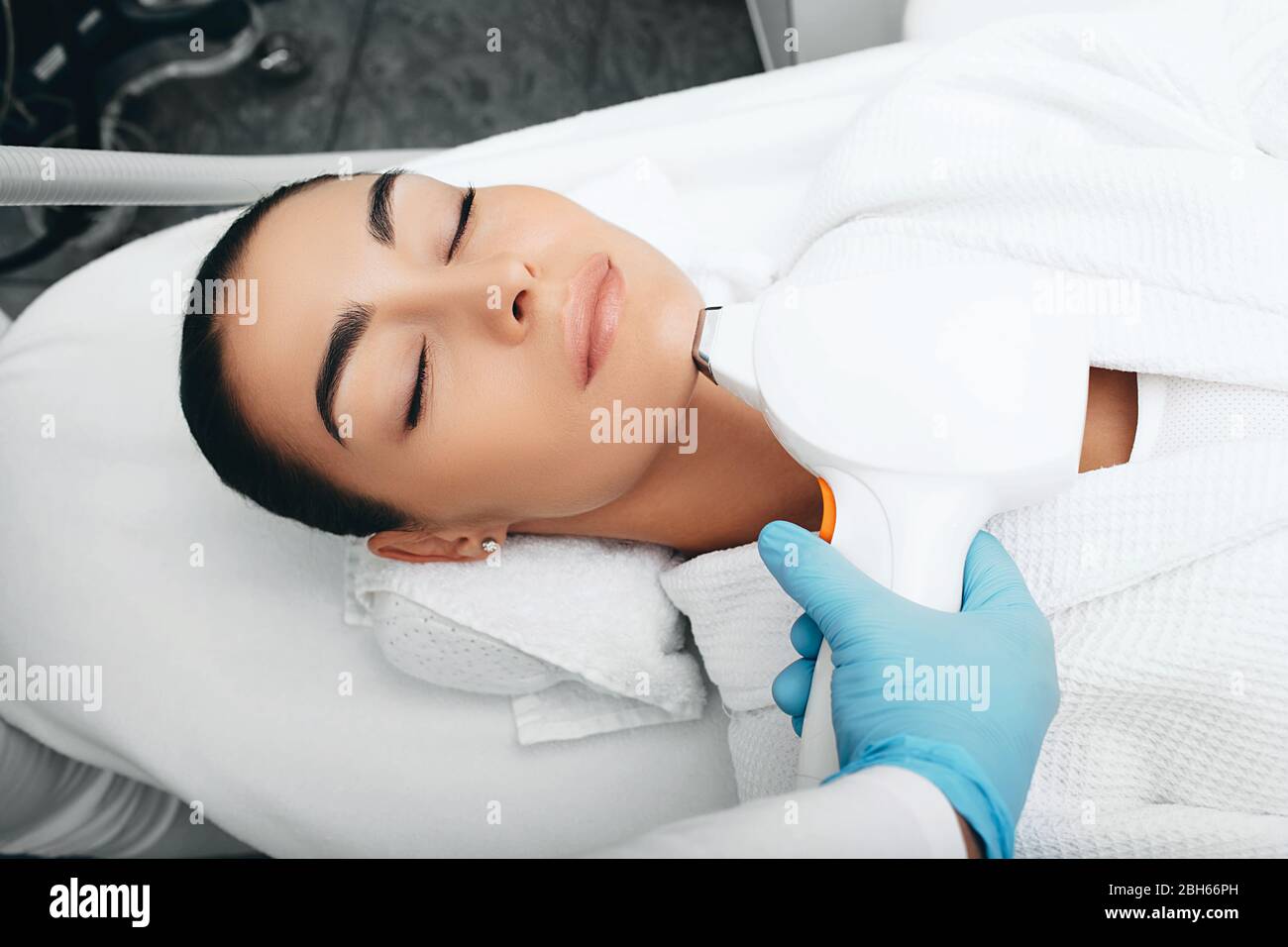 Laser hair removal on a woman's face. Hair removal on chin Stock Photo