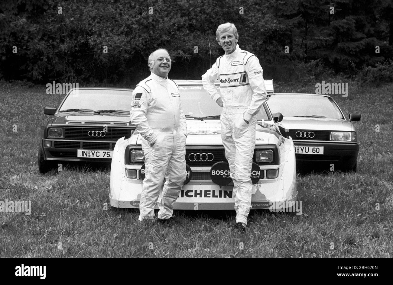 Former Labor Minister Norbert Bluem died at the age of 84. Archive photo: Norbert BLUEM, left, Blum, CDU, politician, Federal Minister of Labor, in a racing suit, and Audi factory driver Walter ROEHRL Rohrl, test driver, rally, both stand in front of an Audi Quattro, when visiting automaker Audi, test driver, test drive, half FIGURE, half-length figure, B/W photo, undated photo, approx. 1983, | usage worldwide Stock Photo