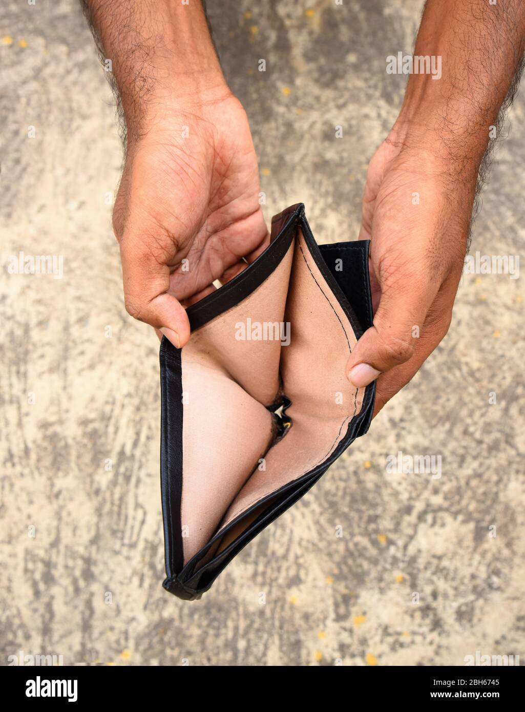 hand holding empty wallet - recession Stock Photo