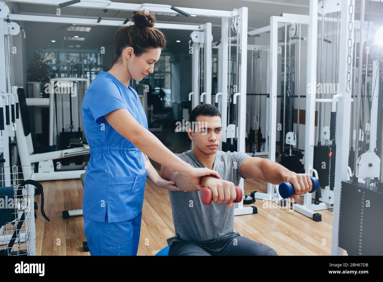 Athlete recovery after an elbow injury. Rehabilitation center for rehabilitation. Physiotherapist's appointment Stock Photo