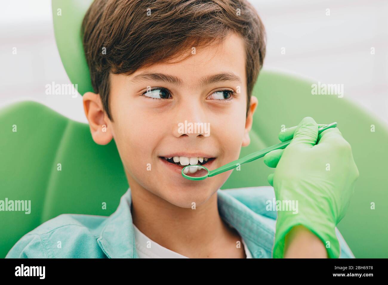 children's teeth exam. Closeup little boy having teeth exam at dental clinic Stock Photo Alamy