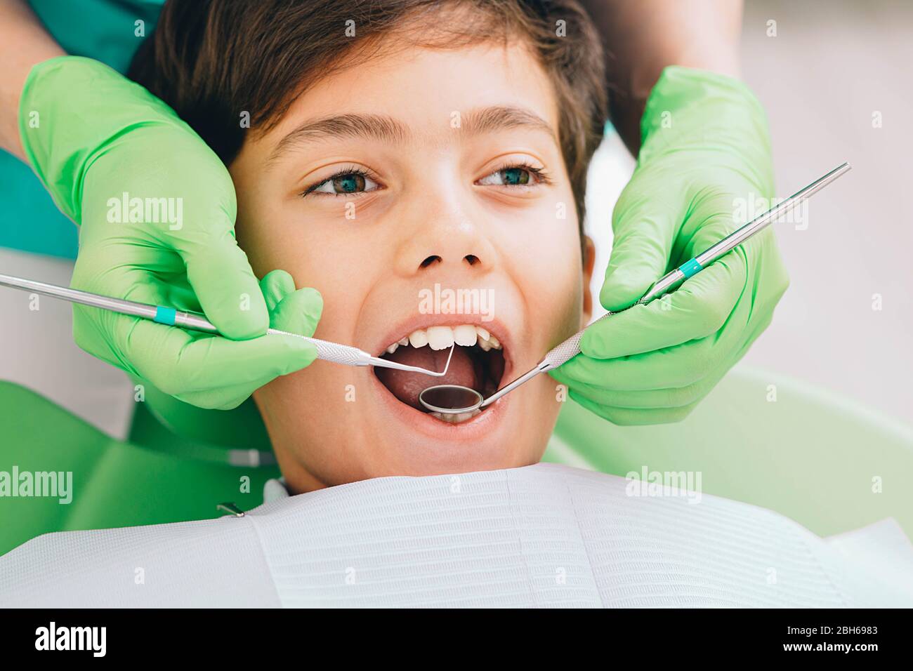 children's teeth exam. Closeup little boy having teeth exam at dental clinic Stock Photo Alamy