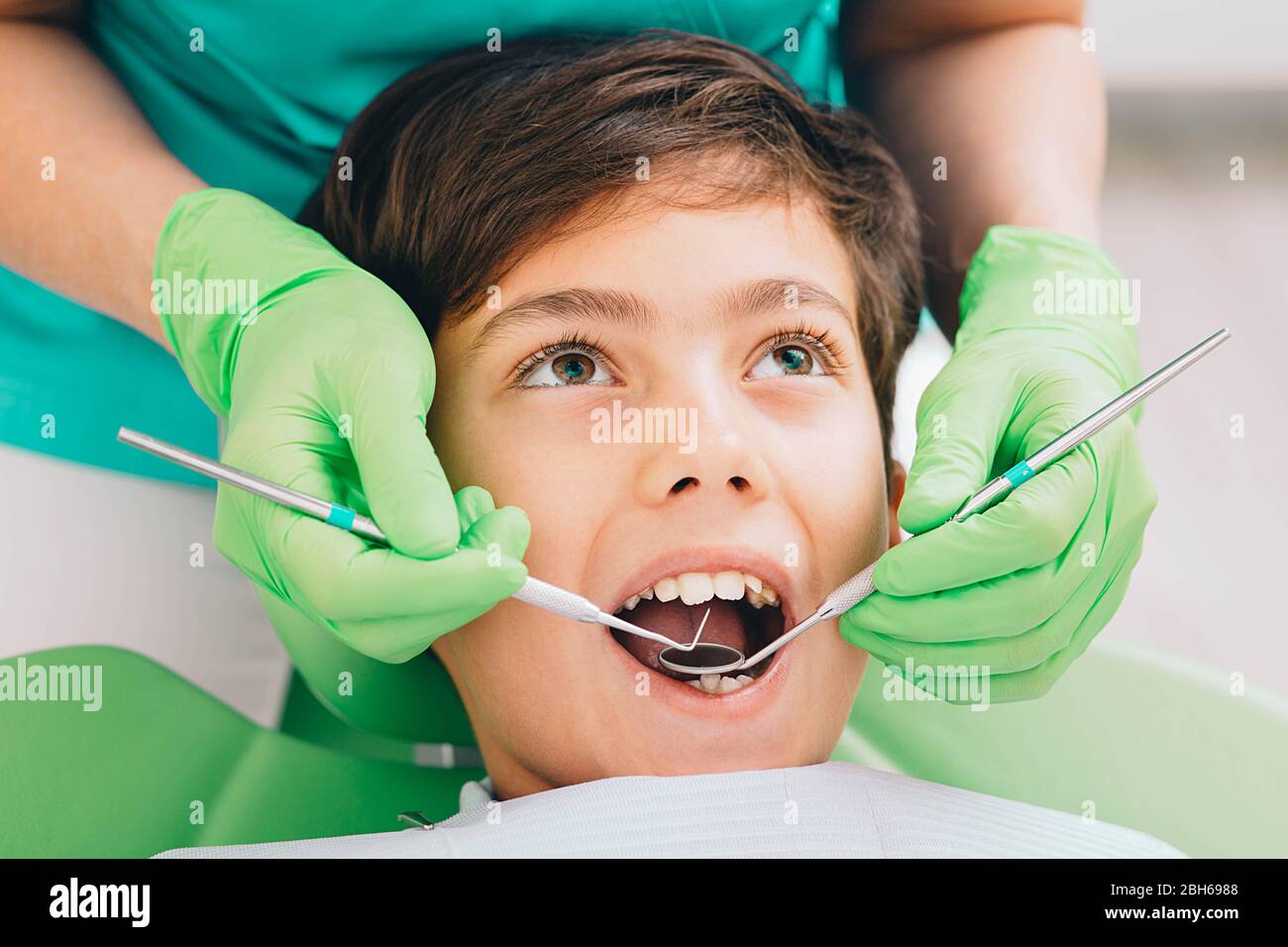 Little boy while teeth exam. Dental exam teeth to a children Stock Photo
