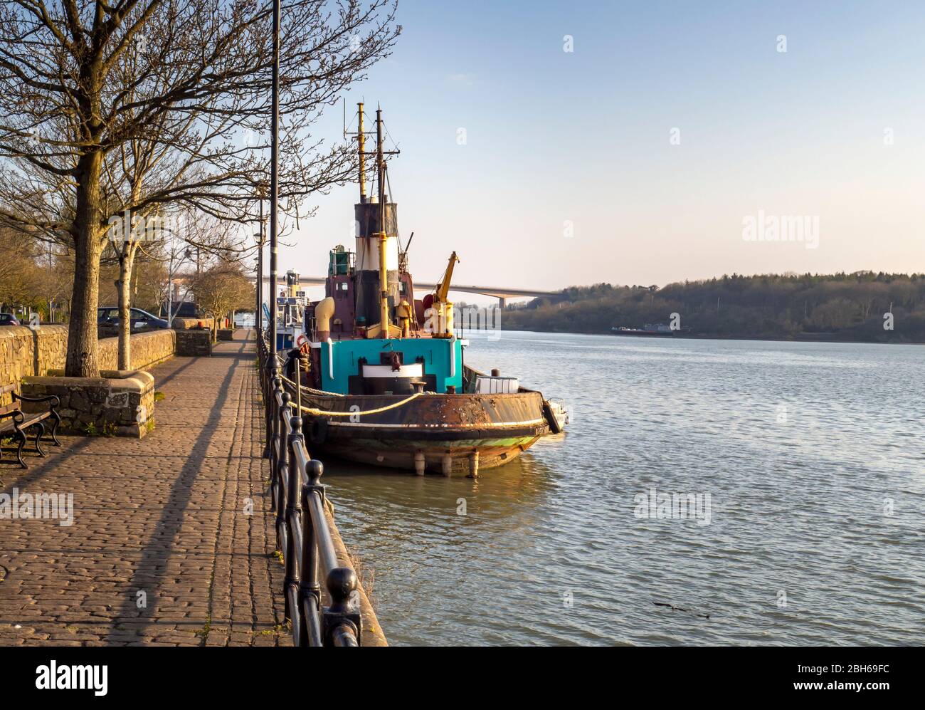 BIDEFORD, NORTH DEVON, ENGLAND, UK - MARCH 28 2020: Old boat, maybe tug, moored on the quay in this small, historic harbour town. Spring sunshine. Stock Photo