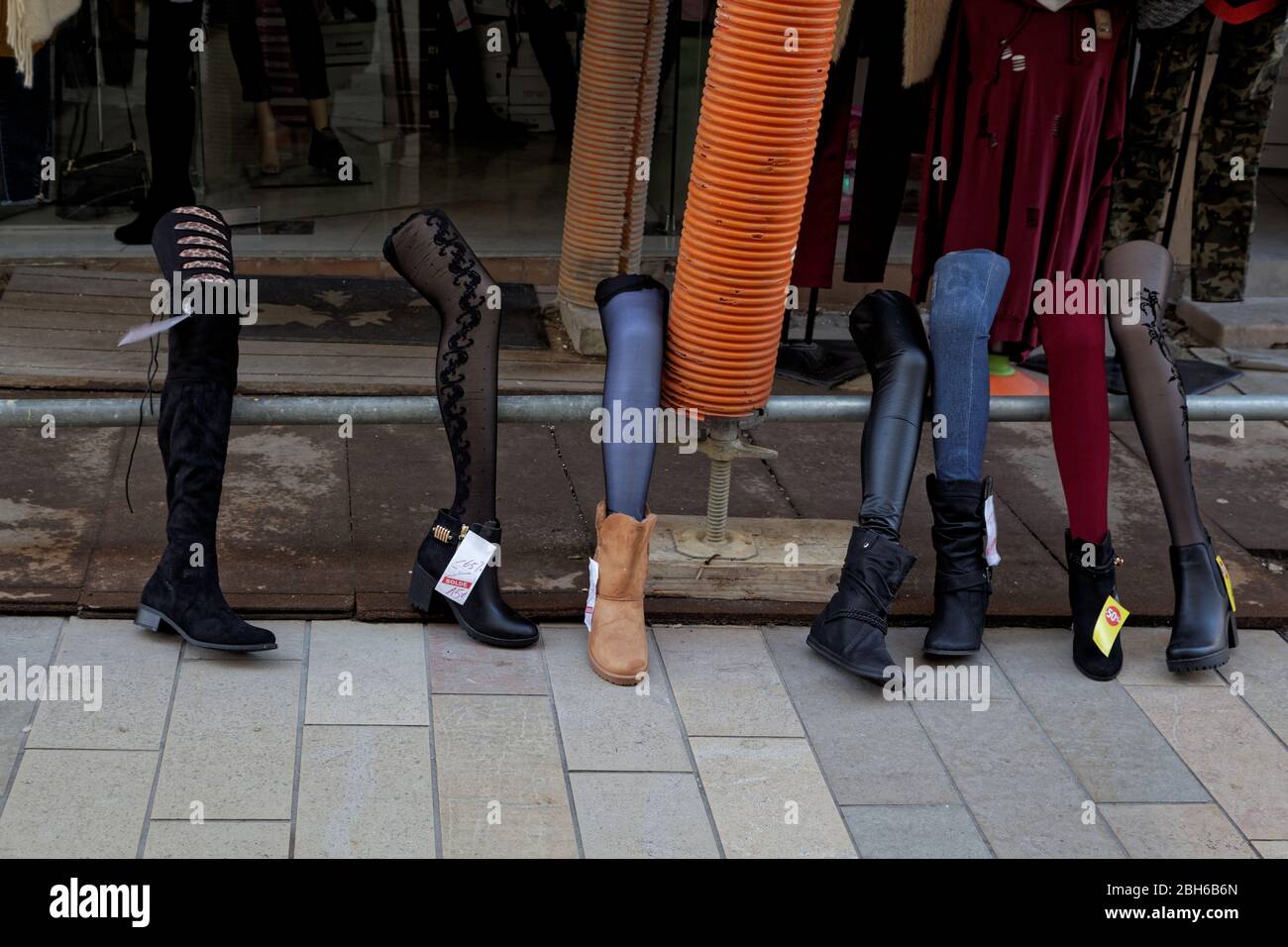 Novelty Legs used as a street display to sell boots in Meaux, France