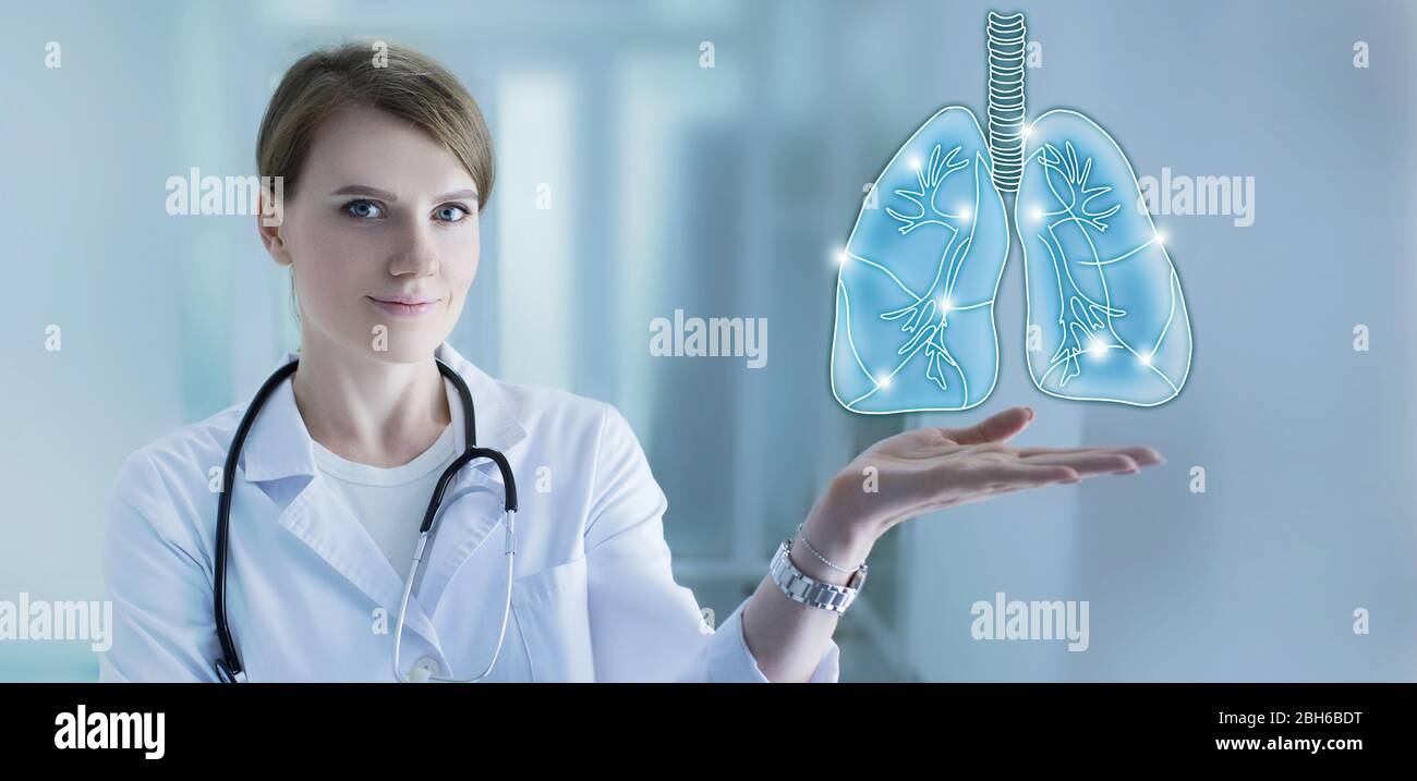 Lungs treatment. Doctor Holding holographic human lungs while standing