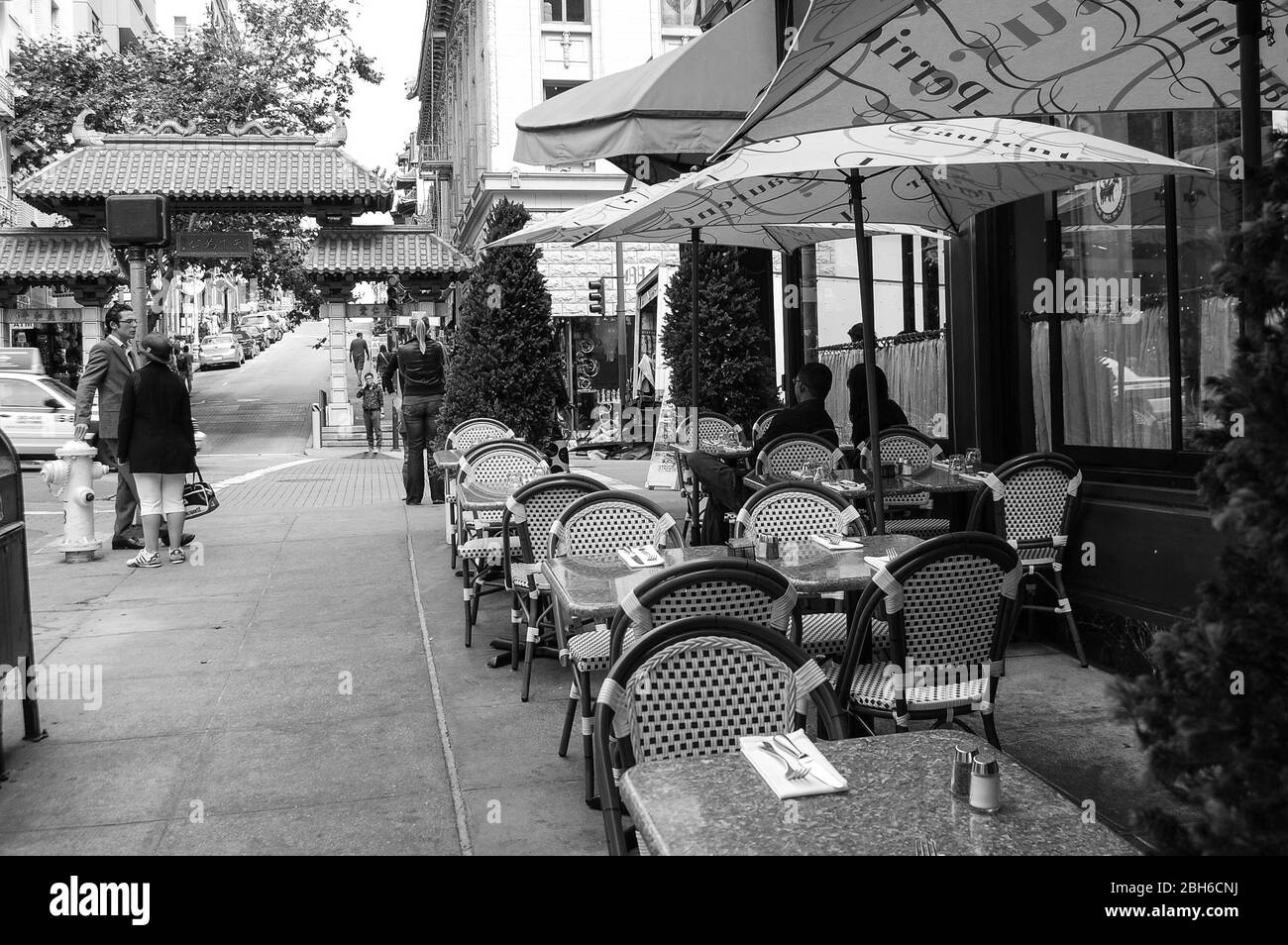 San Francisco restaurant seats seating chair chairs canopy China Town talking talk shades shade salt and pepper hydrant water path view window Stock Photo