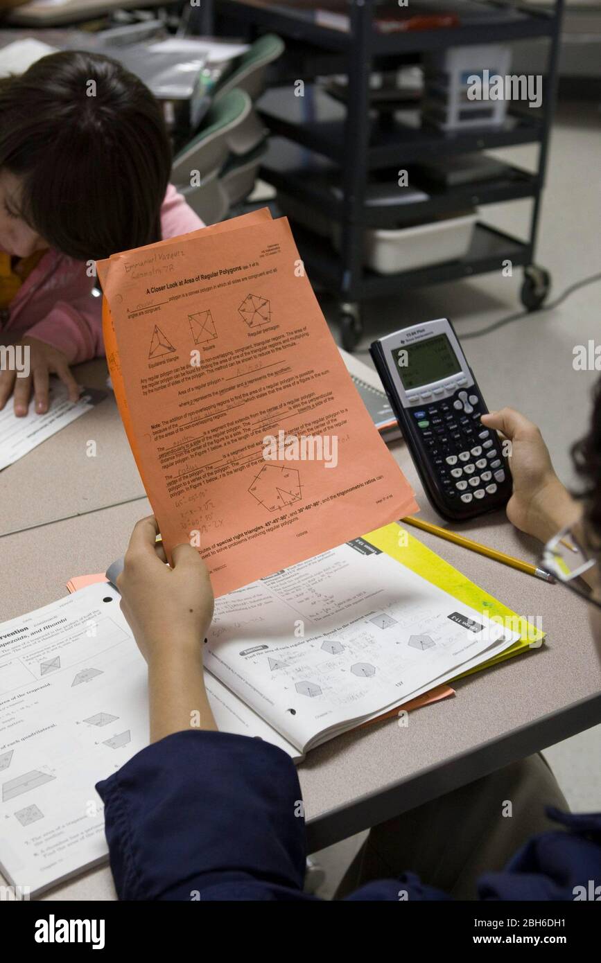 Laredo, Texas USA, February 19, 2009: High school student in math class using Texas Instruments calculator for Algebra II study at the Early College High School located on the campus of Texas A&M International University. ©Bob Daemmrich Stock Photo