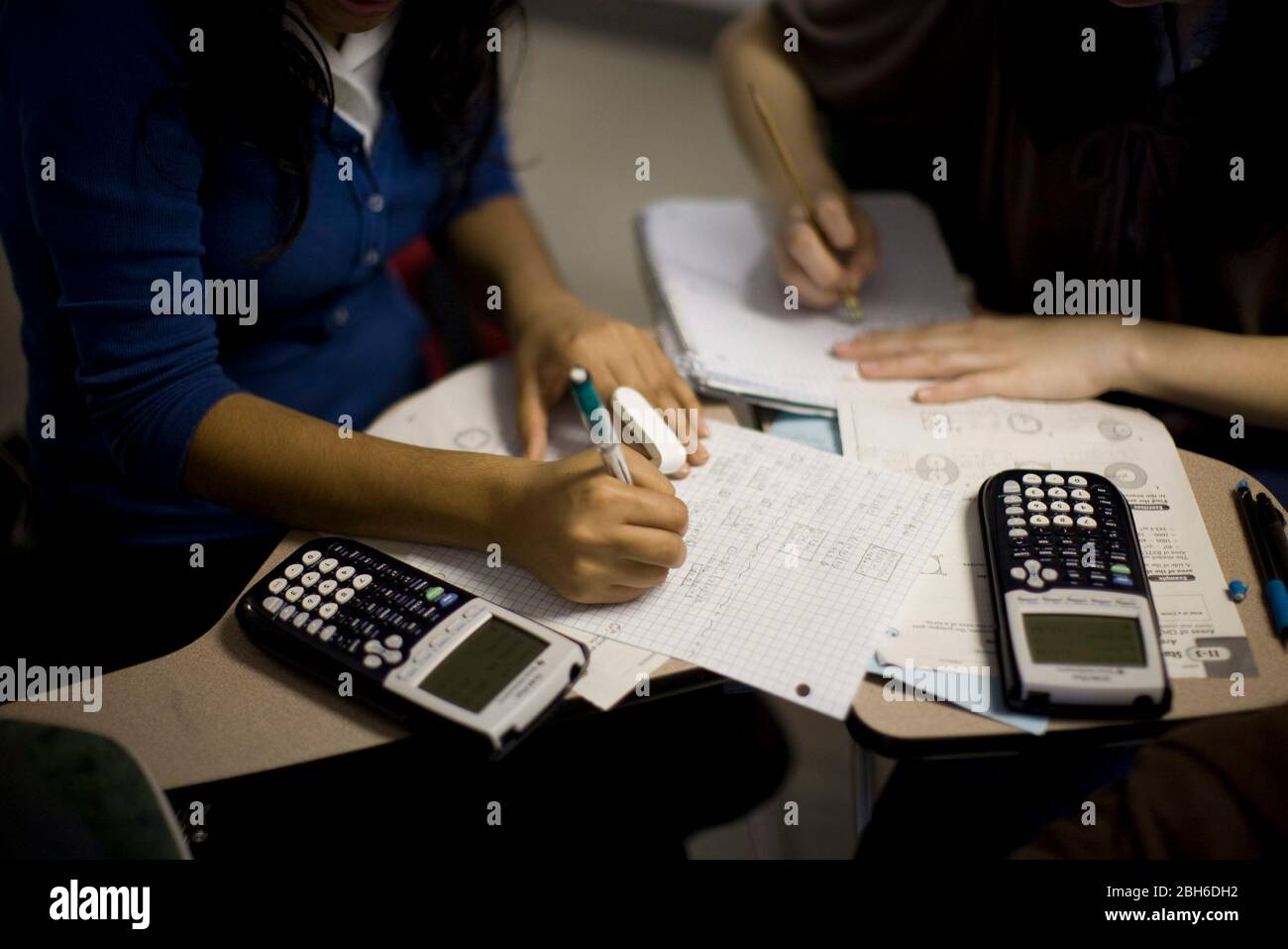 Laredo, Texas USA, February 19, 2009: High school students using Texas Instruments graphing calculators during Algebra II class at the Early College High School located on the campus of Texas A&M International University.  ©Bob Daemmrich Stock Photo