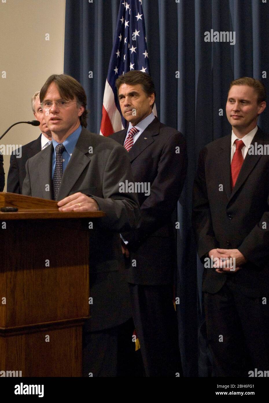 Austin, Texas USA, April 29th, 2009: Dr. David Lakey, Commissioner of the Texas Department of State Health Services, speaks at a press conference o discuss the state's efforts in response to the swine flu. Gov. Rick Perry stands behind Lakey and state education commissioner Robert Scott stands on the right. ©Marjorie Kamys Cotera/Daemmrich Photography Stock Photo