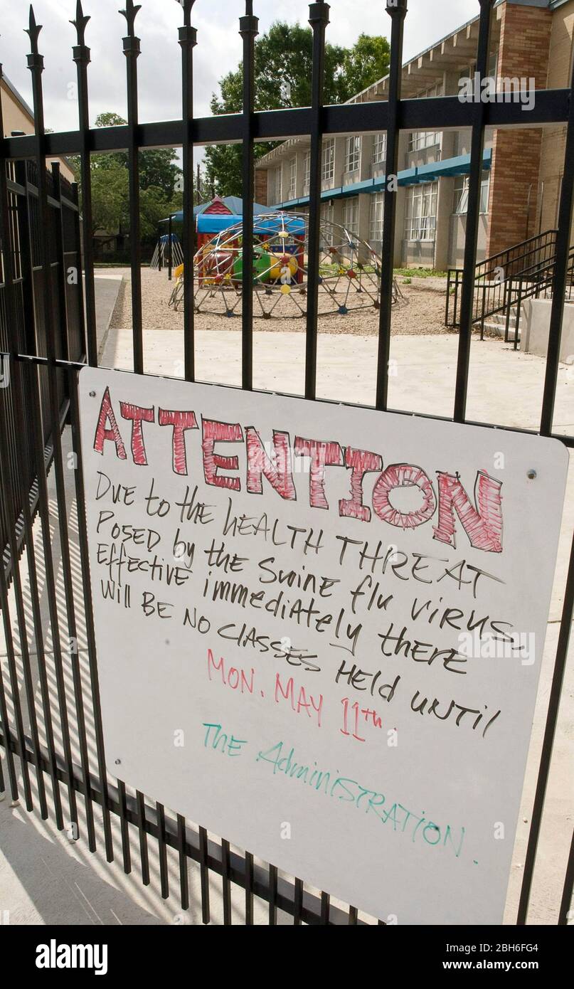 New Braunfels, Texas USA, April 30 2009: A handwritten sign on the entrance gate at Saints Peter and Paul Catholic School informs students and parents that all classes are cancelled until May 11 out of concern over the spreading of the H1N1 influenza A virus or 'swine flu.'  ©Marjorie Kamys Cotera/Daemmrich Photography Stock Photo