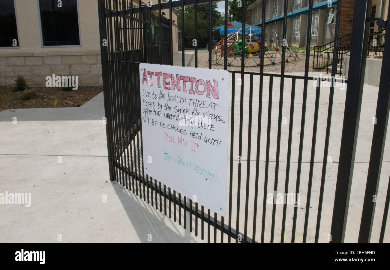 New Braunfels, Texas USA, April 30 2009: A handwritten sign on the entrance gate at Saints Peter and Paul Catholic School informs students and parents that all classes are cancelled until May 11 out of concern over the spreading of the H1N1 influenza A virus or 'swine flu.'  ©Marjorie Kamys Cotera/Daemmrich Photography Stock Photo