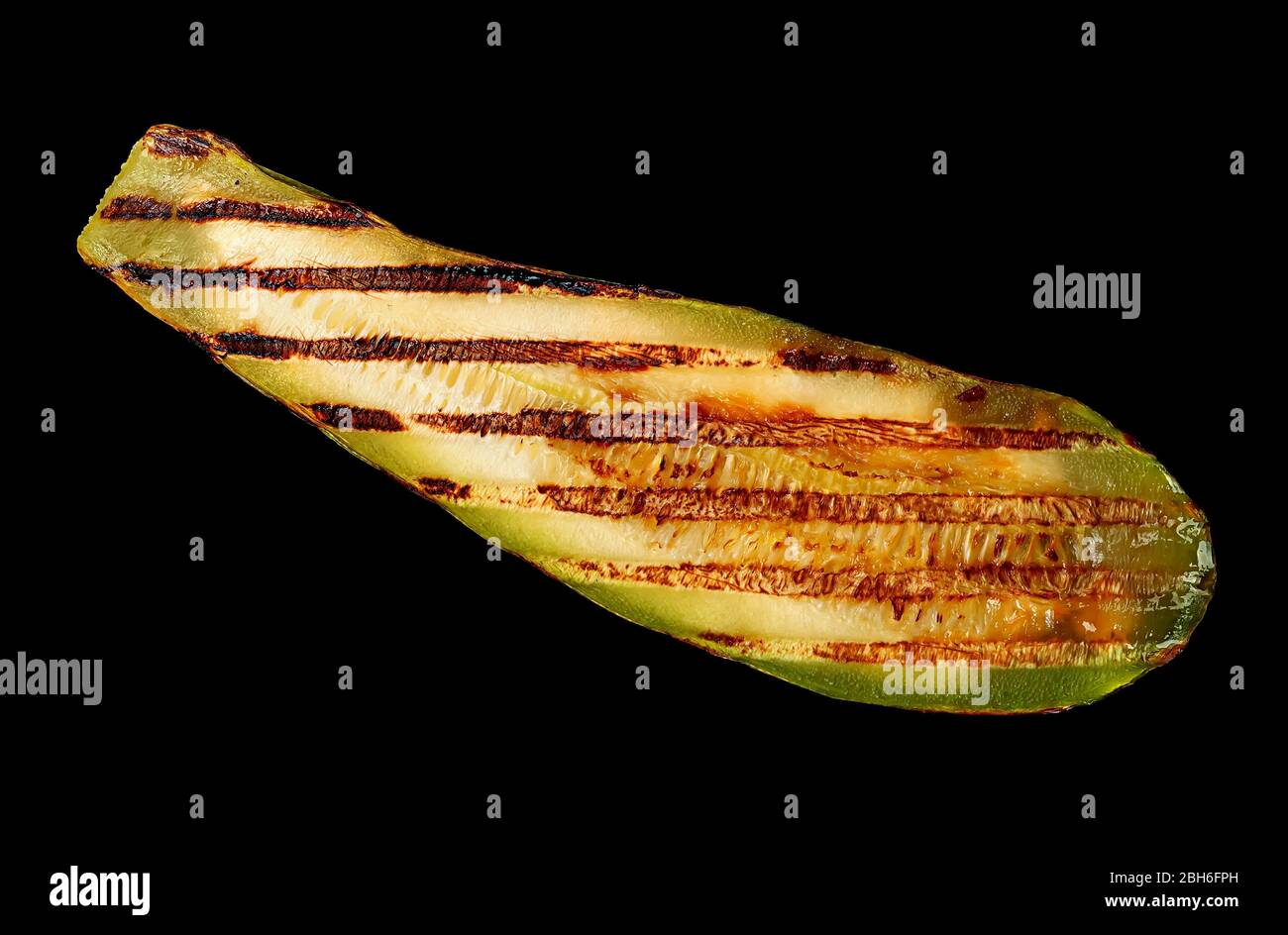 Piece of grilled zucchini on black Stock Photo