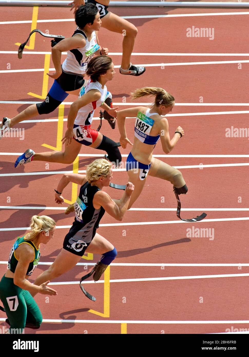 Beijing, China, September 13, 2008: Day 8 of athletic competition at the Beijing 2008 Paralympic Games shows Marie-Amelie le Fur of France ahead of the pack in the first round of the T44 women's 100-meters. Others shown are Maya Nakanishi (4) of Japan and Kae Horan of New Zeland (6).©Bob Daemmrich Stock Photo