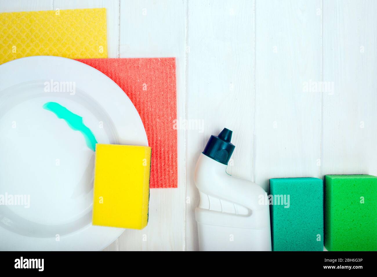 washing dishes and cleaning detergent on wooden table, top view Stock Photo