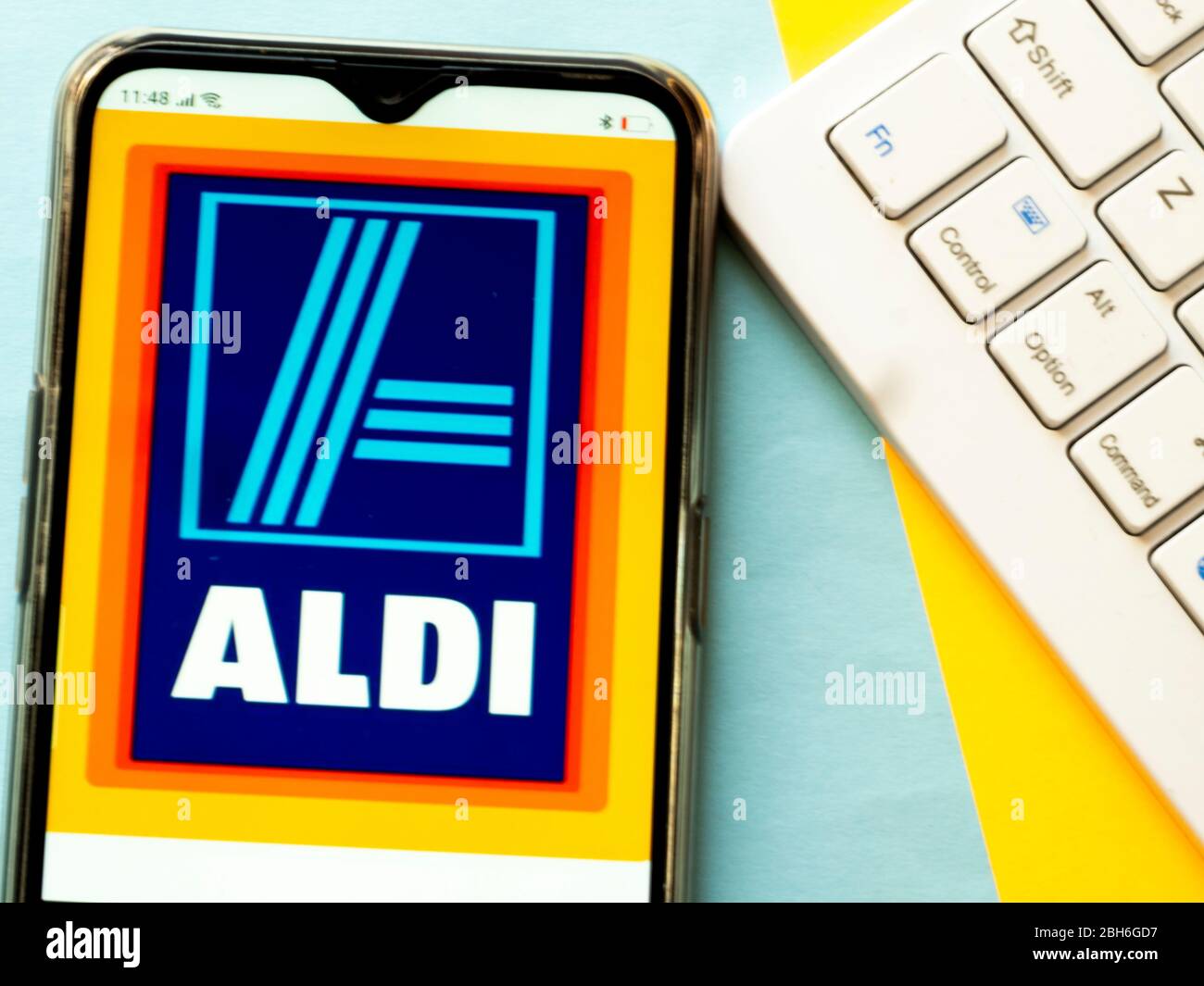 In this photo illustration Aldi logo is seen displayed on a smartphone ...
