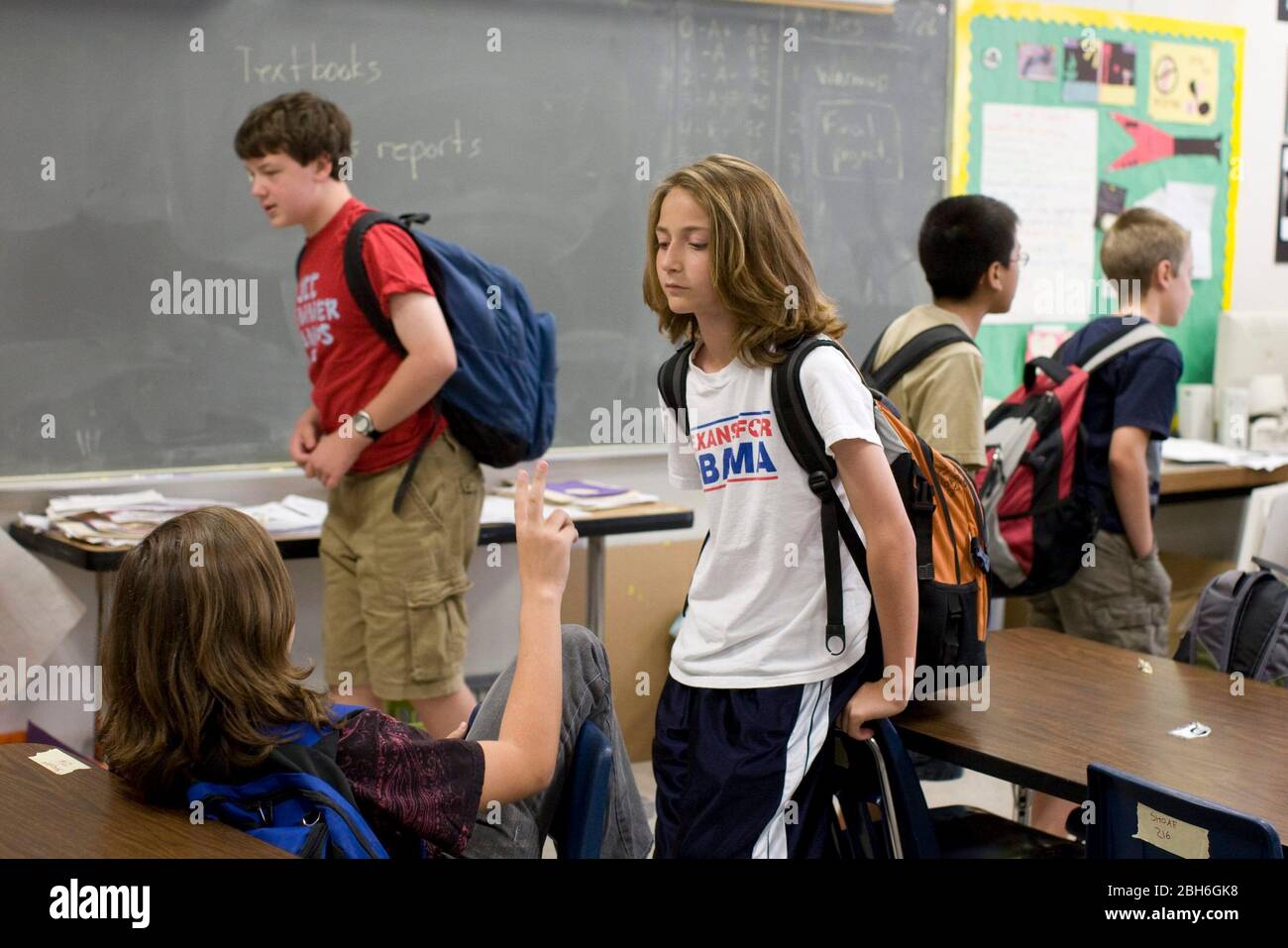 Austin, Texas USA, May 28, 2009: Sixth grade students with heavy backpacks prepare to leave class at Kealing Middle School..  There are no lockers in the school so kids have to carry everything on their backs.  ©Bob Daemmrich Stock Photo