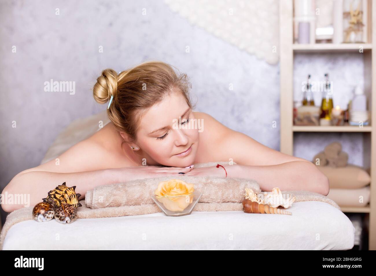 healthy and beautiful blond woman in spa salon. Traditional oriental aroma therapy and beauty treatments. Stock Photo