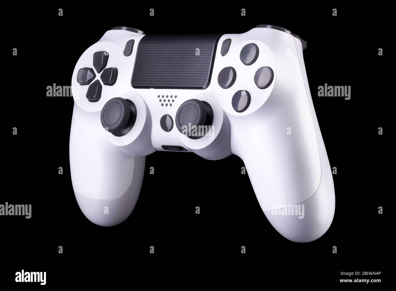 White video game joystick gamepad isolated on a black background with ...