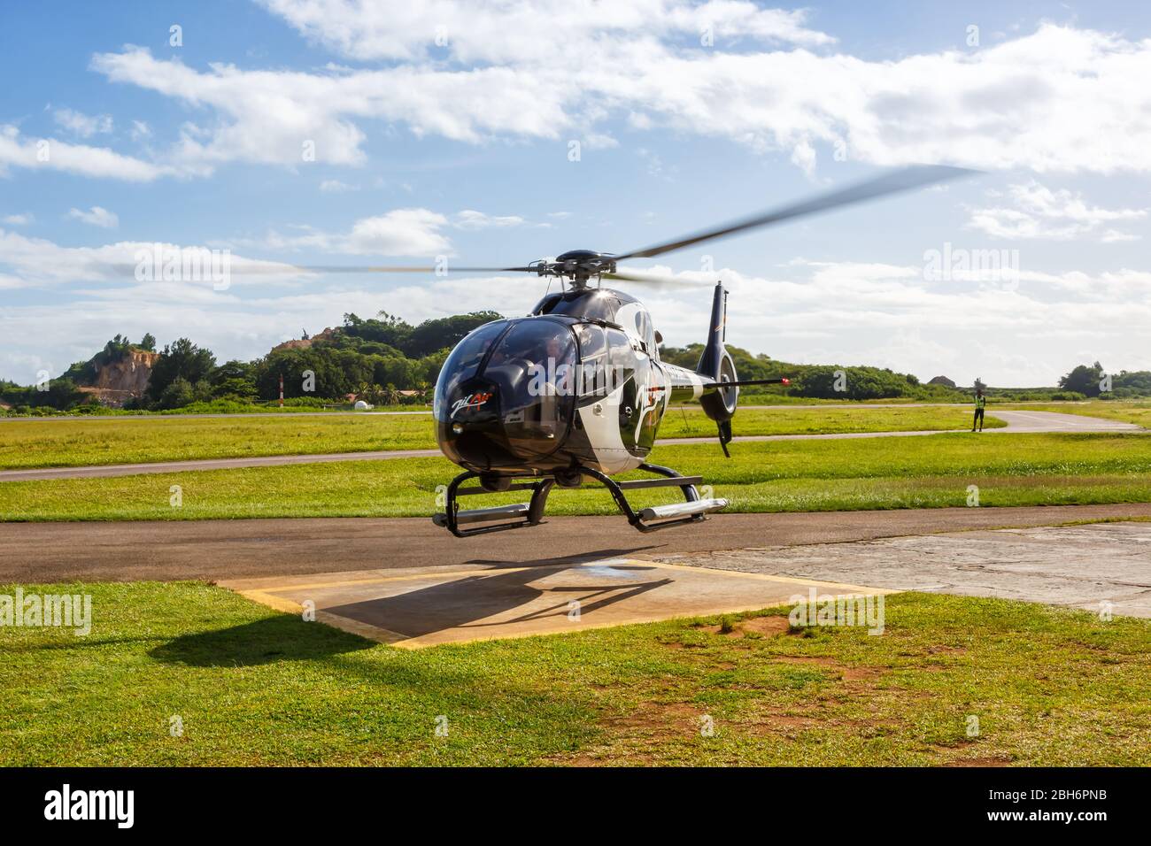 Mahe, Seychelles – February 8, 2020: Zil Air Airbus H120 helicopter at Mahe airport (SEZ) in the Seychelles. Stock Photo