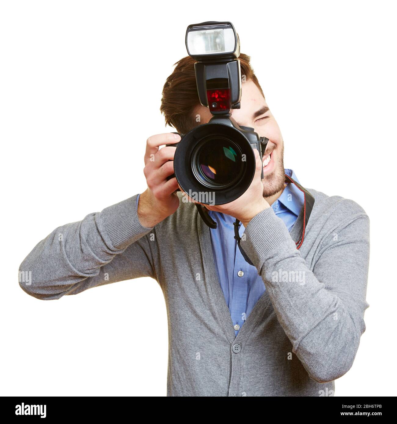 Professional photographer with a digital camera and a system flash Stock Photo