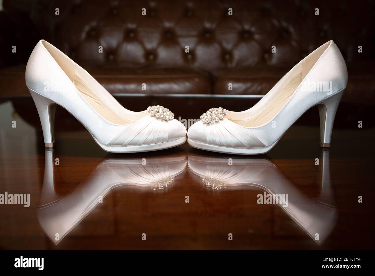 Luxury Wedding Shoes sitting on a reflective surface Stock Photo Alamy