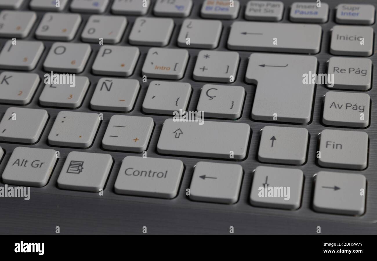 grey laptop keyboard with white keys Stock Photo
