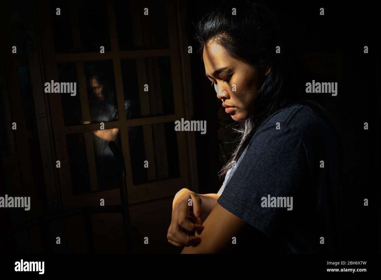 Thai woman and her reflection, Bangkok, Thailand Stock Photo