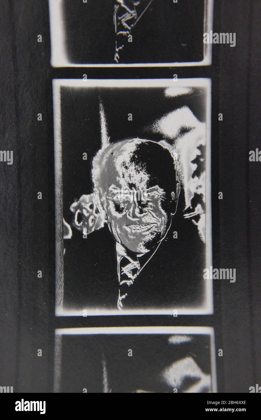 Fine 70s vintage extreme high contrast contact print photography of a creepy old man smiling at the camera Stock Photo