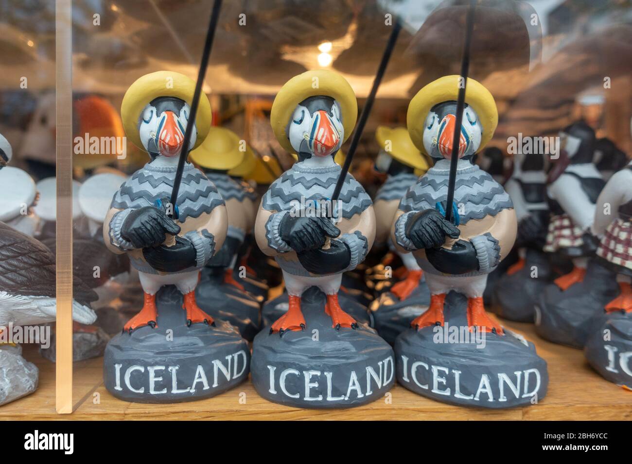 Puffin in Icelandic jumpers holding fishing rods: souvenir ornaments in a shop window in Reykjavik, Iceland. Stock Photo