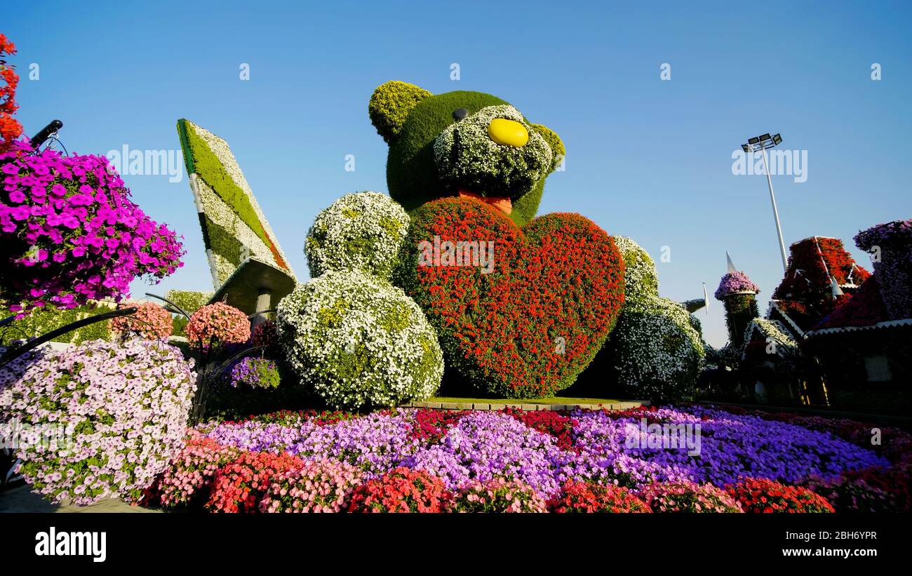 Dubai, UAE December 14, 2019 Teddy bear holds a big heart in his