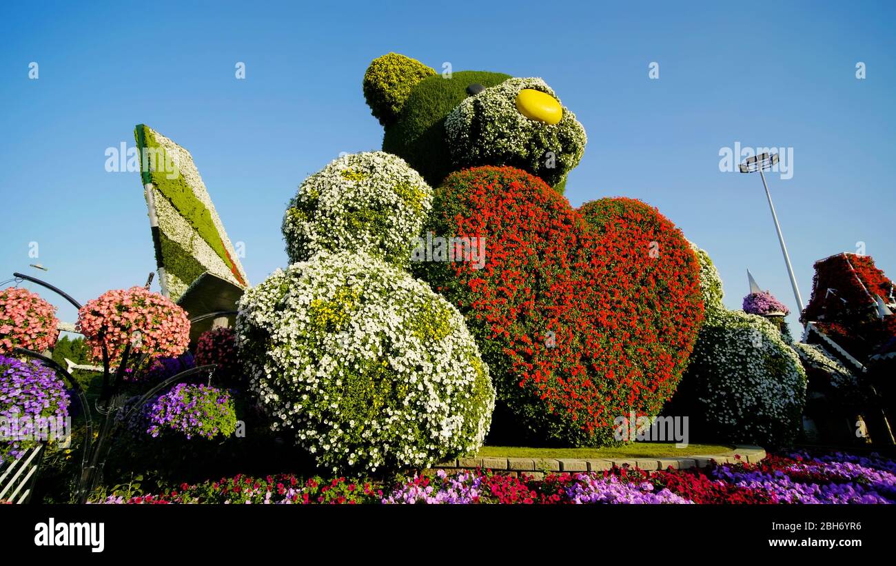 Dubai, UAE December 14, 2019 Teddy bear holds a big heart in his