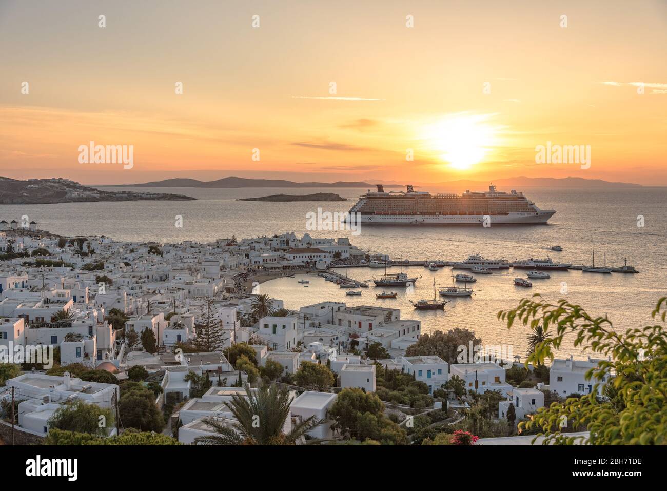 A cruise ship ruins an otherwise great sunset on Mykonos Stock Photo