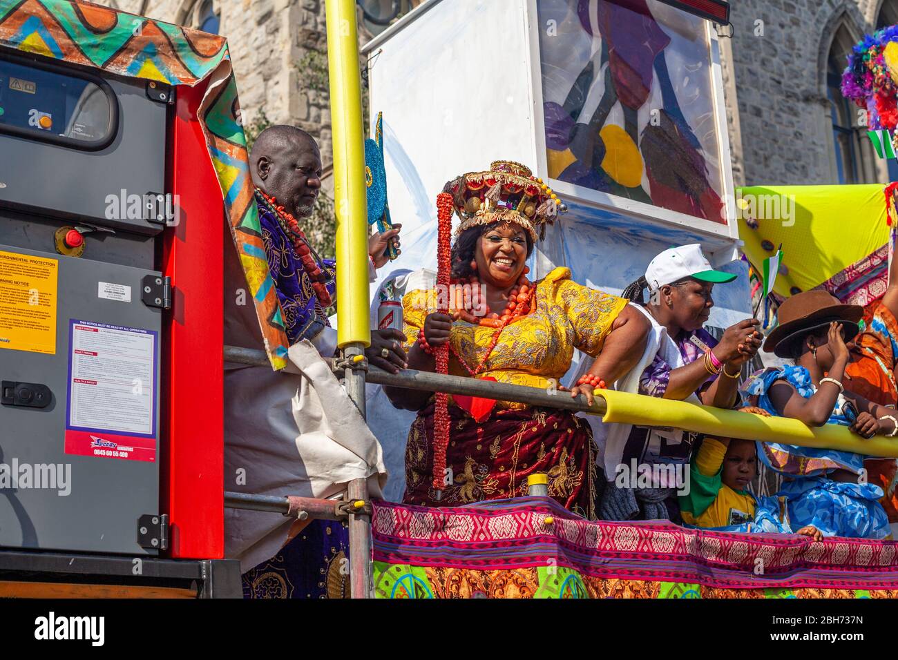 LONDON, UNITED KINGDOM – 26 AUGUST  2013: Carnival performers at sunny day celebrating annual  event in Notting Hill Stock Photo