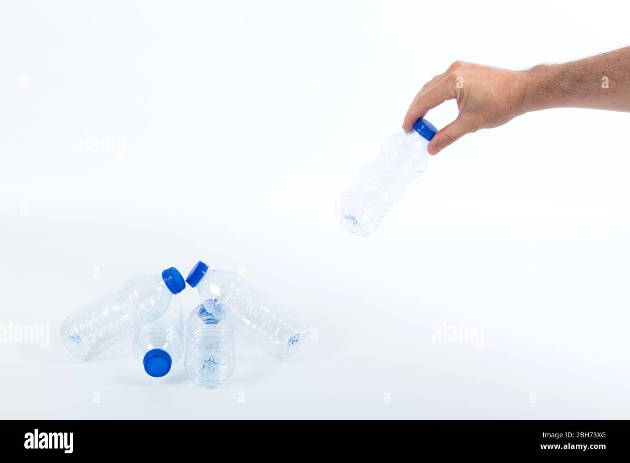 one hand recycling plastic bottles Stock Photo