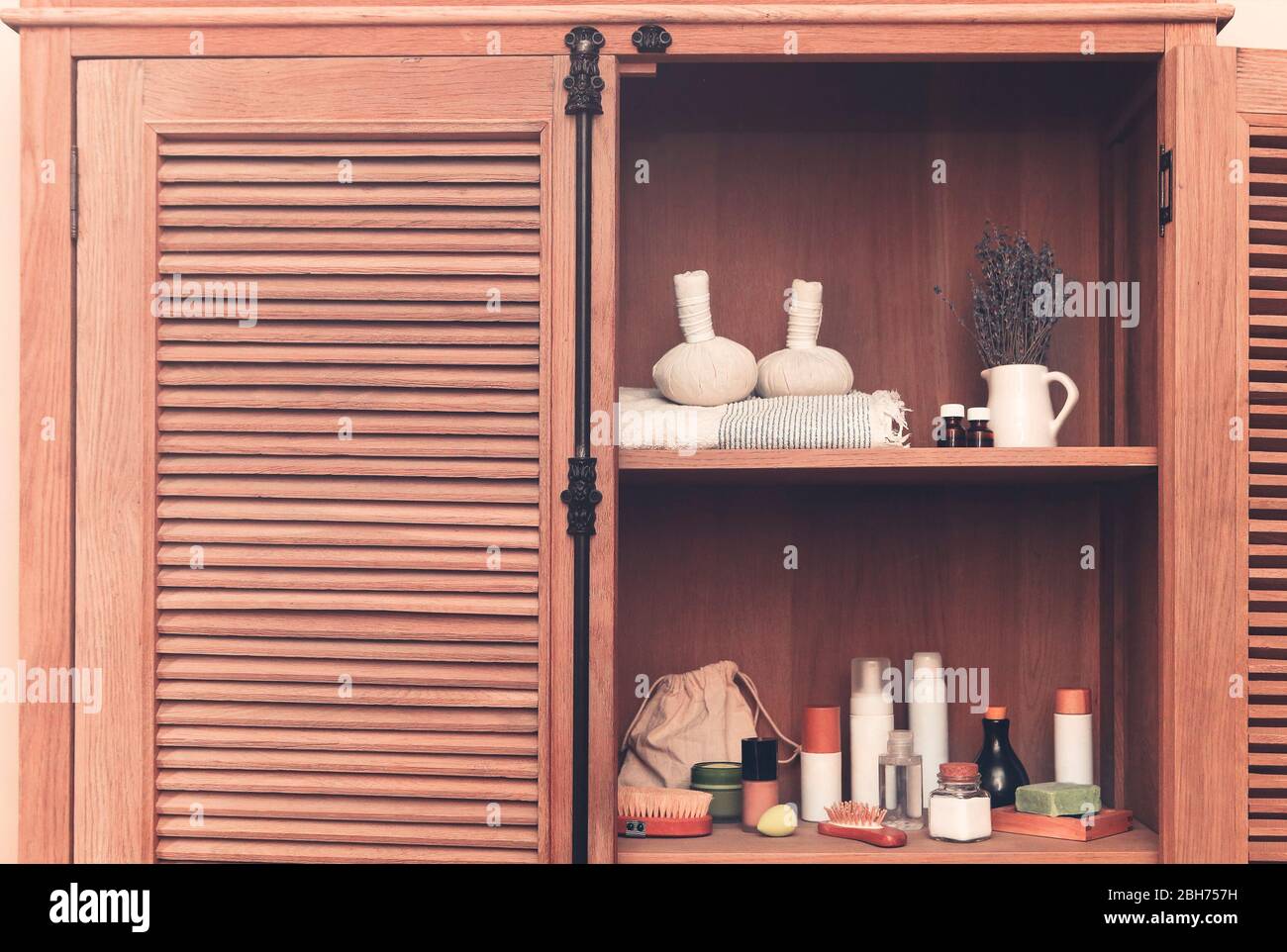 Bath accessories on shelves in bathroom. Cosmetics on the shelves in