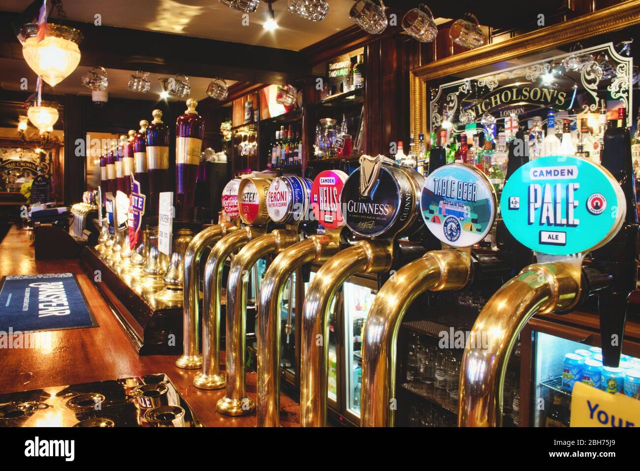 Oxford, UK - 02 March 2020: Rows of draught beer in a typical British pub Stock Photo