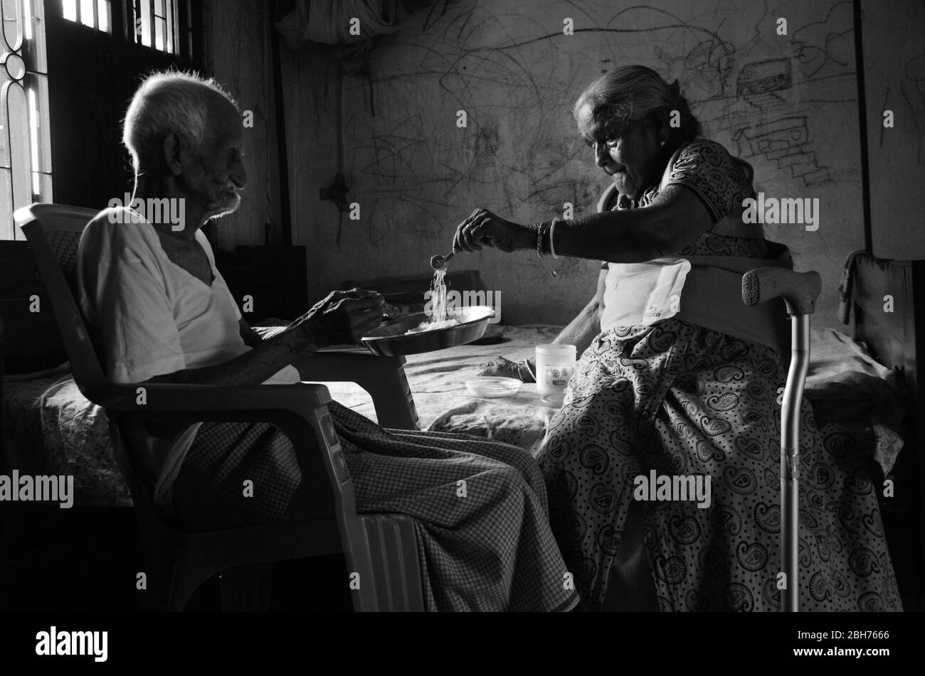 The old couple during COVID-19 epidemic doing their best supporting each other in the time of crisis, Nabagram, Hooghly. West Bengal; India. Stock Photo