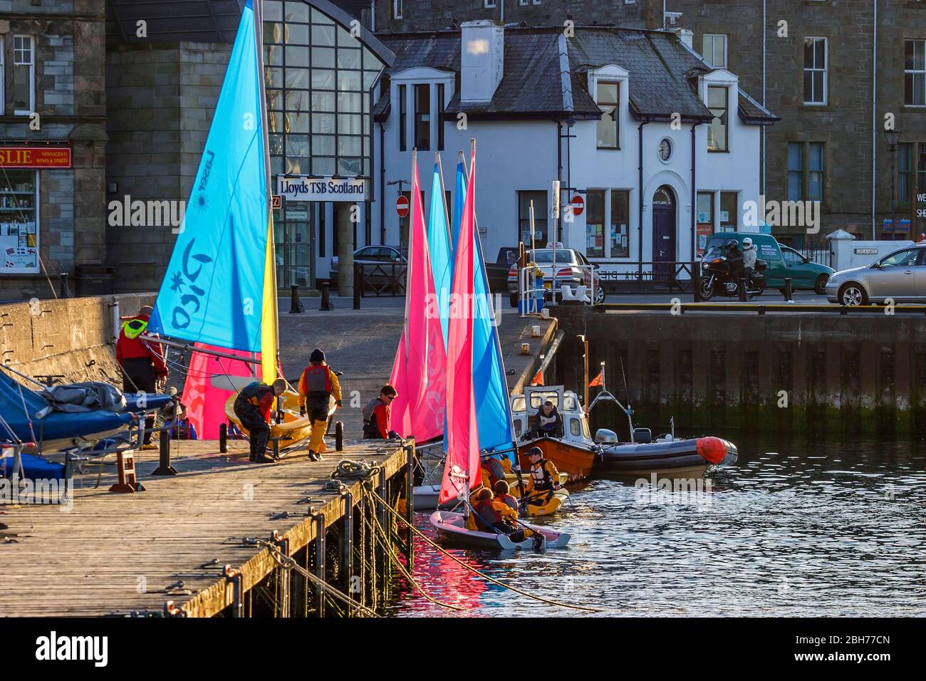Sailboats landing at a jetty in the city of Lerwick in Shetland Stock Photo
