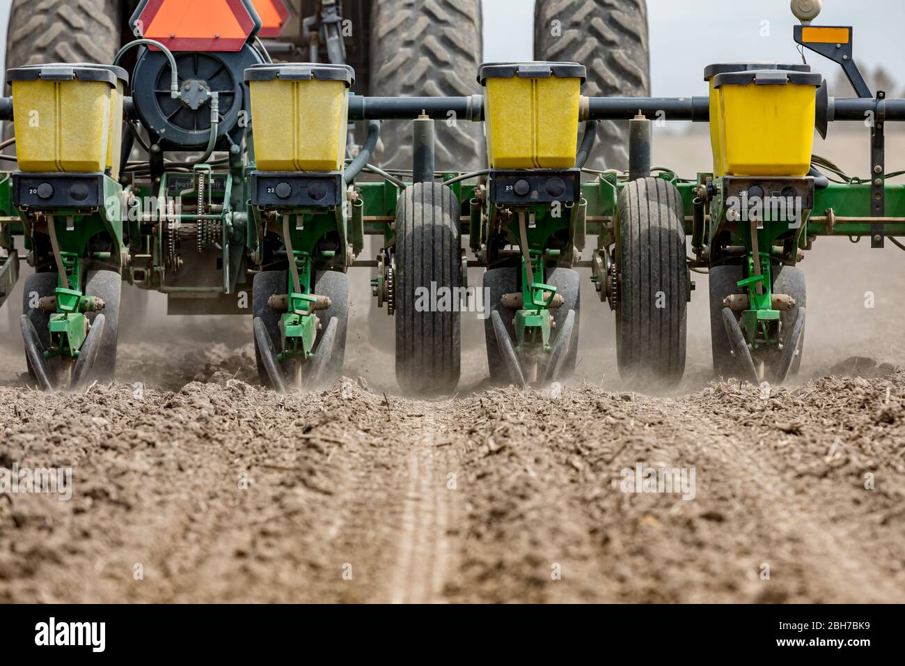 Tractor and planter in farm field planting corn in central Illinois Stock Photo