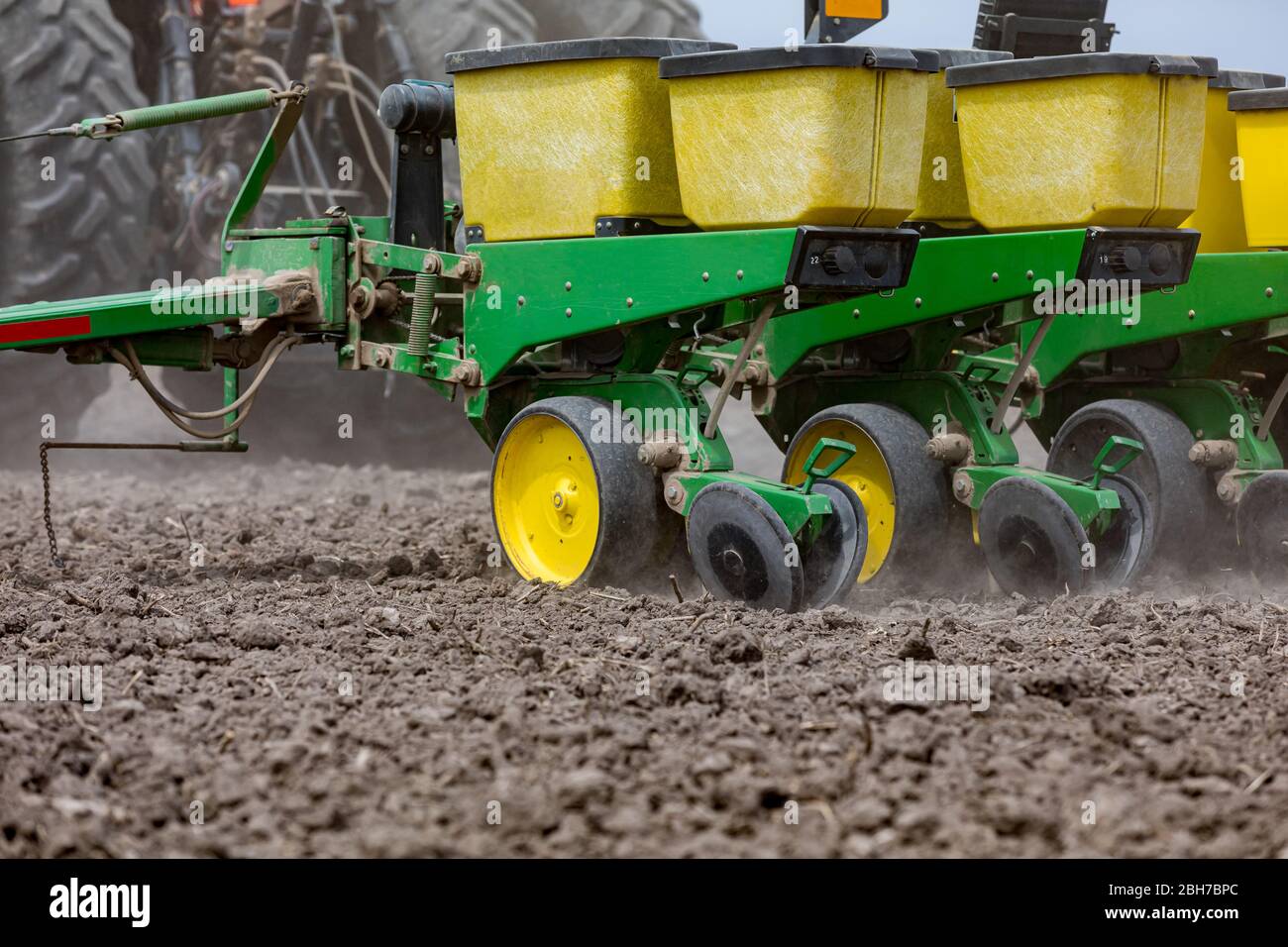 Tractor and planter in farm field planting corn in central Illinois Stock Photo