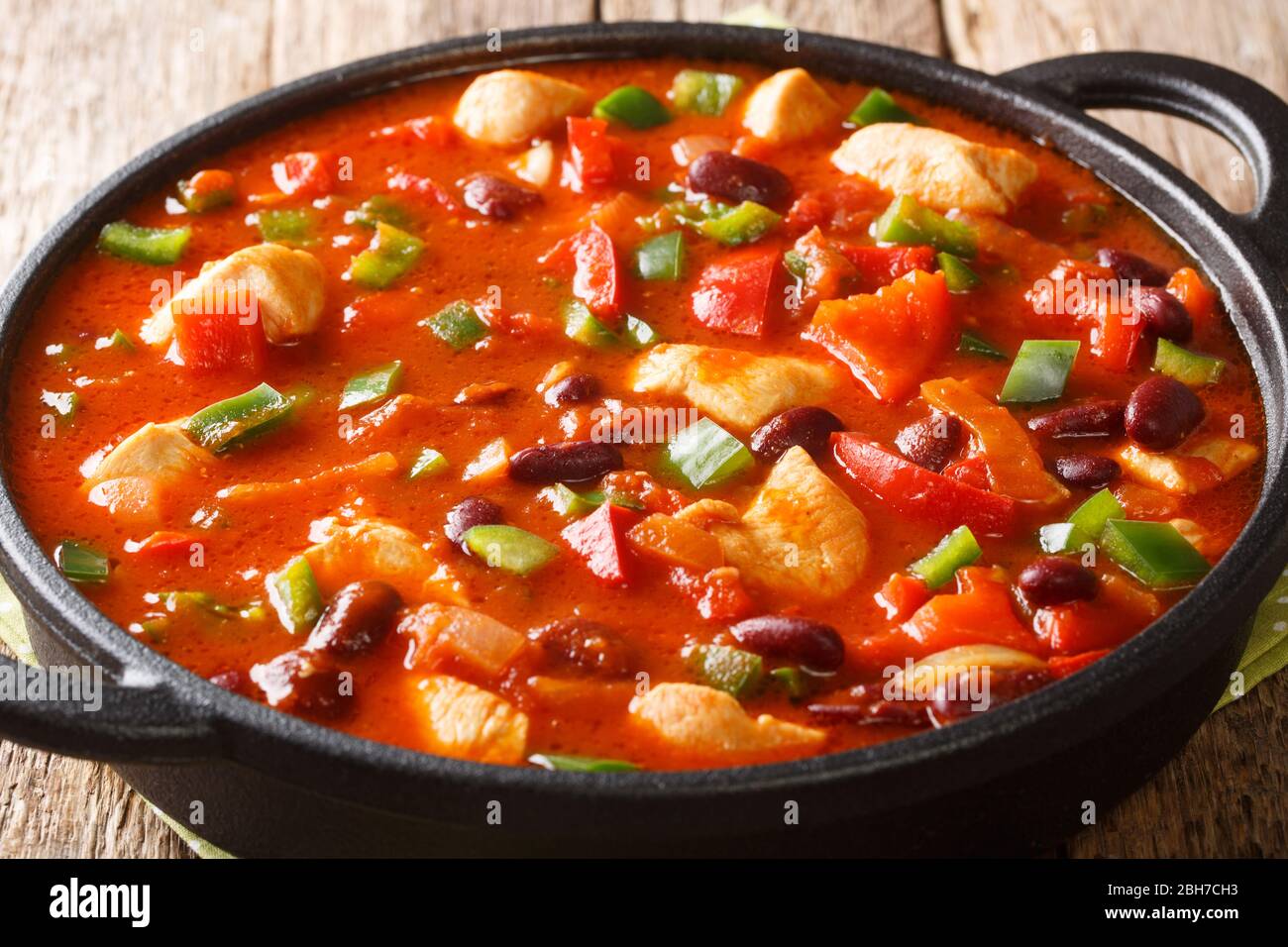 Mexican Chicken With Red Beans In Spicy Chili Sauce Close Up In A Pan On The Table Horizontal Stock Photo Alamy