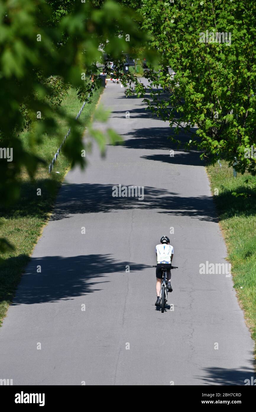 Single cyclist hi-res stock photography and images - Alamy