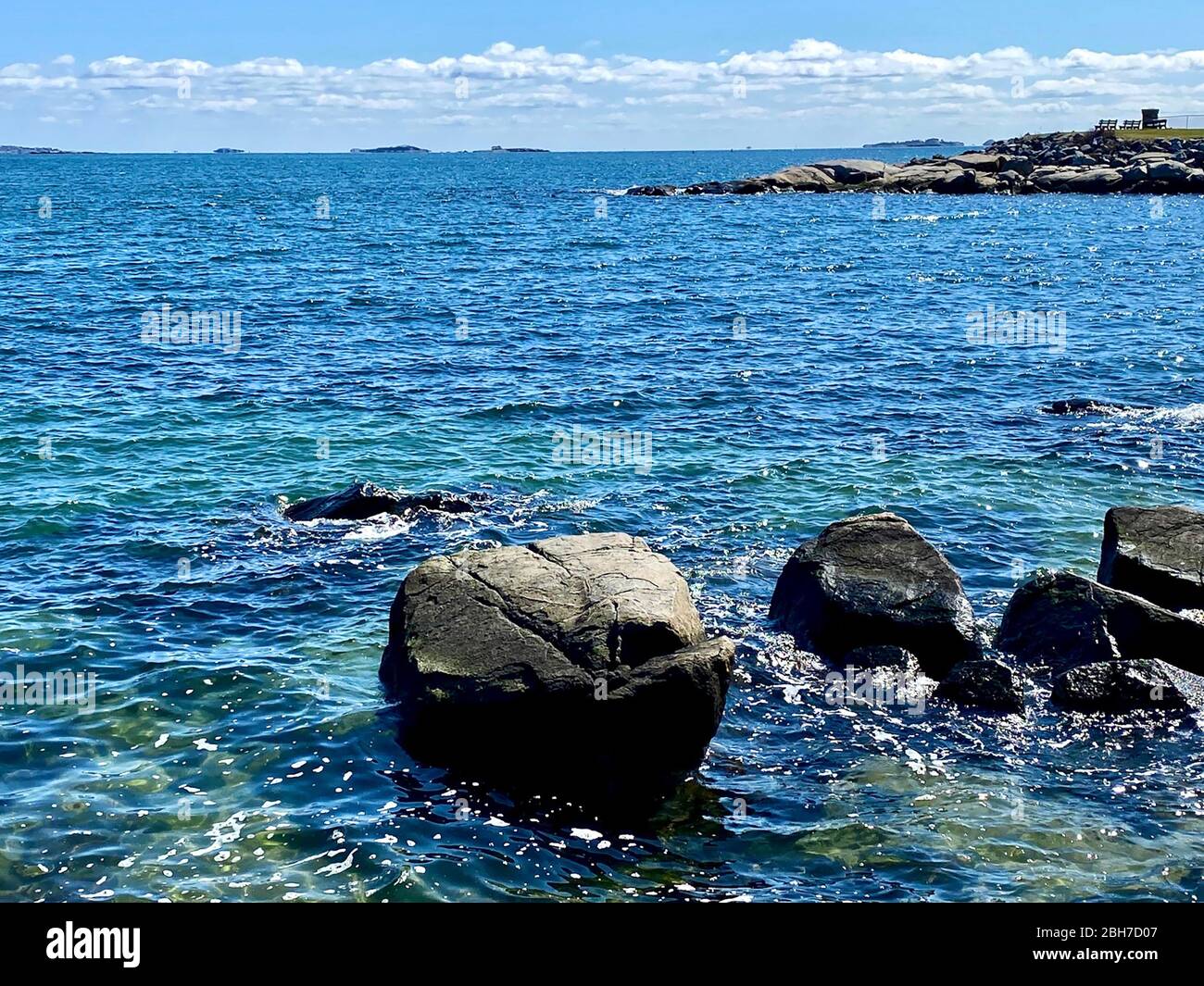 Vista of Rocks and colorful ocean waters Stock Photo