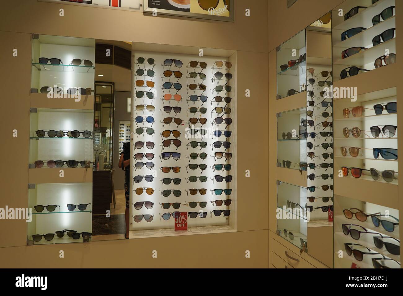 Dubai UAE December 2019 Sunglasses in a store. Sales rack of sunglasses. Prada, Dior, Roberto Cavalli, Ray Ban sunglasses. Close up of rows of sunglas Stock Photo