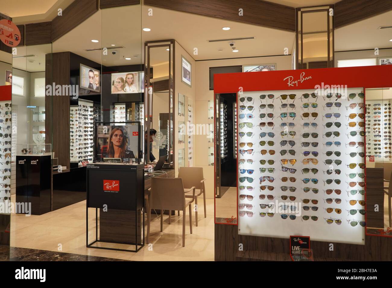 Dubai UAE December 2019 Sunglasses in a store. Sales rack of sunglasses. Prada, Dior, Roberto Cavalli, Ray Ban sunglasses. Close up of rows of sunglas Stock Photo