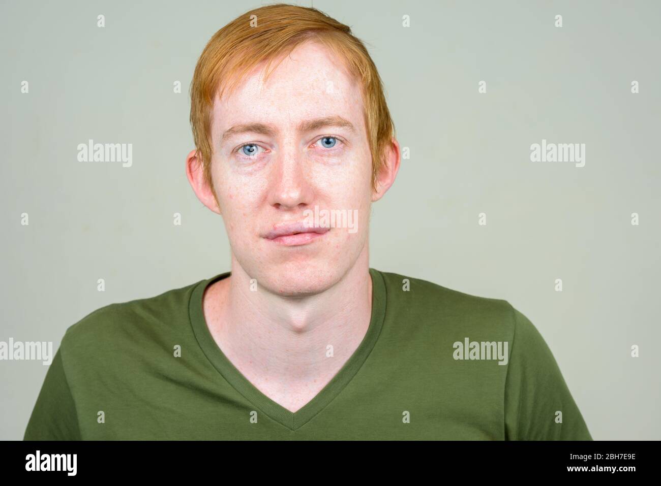 Face of man with red hair looking at camera Stock Photo