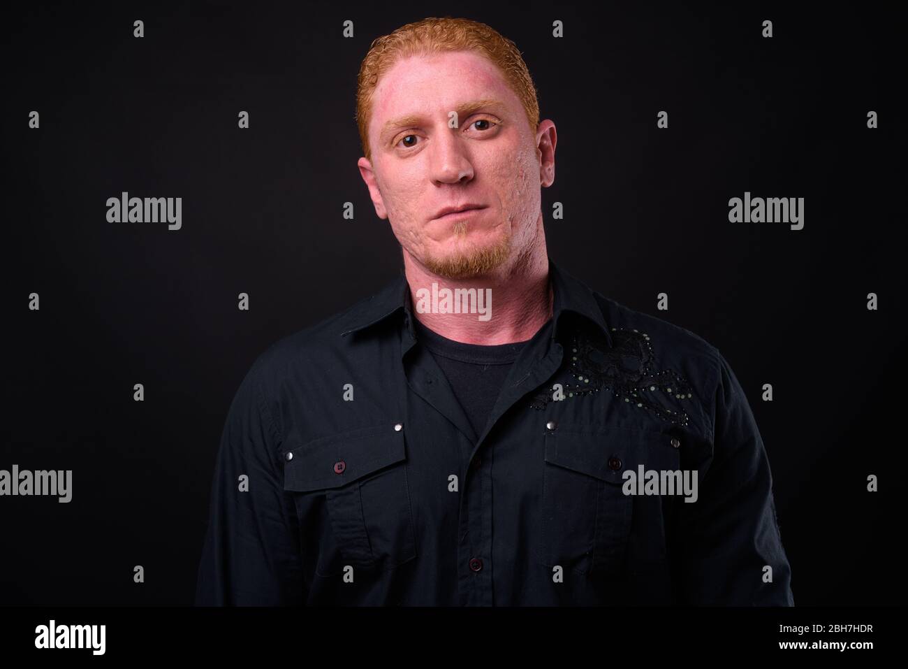 Portrait of muscular man with orange hair Stock Photo